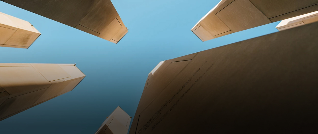 A photograph of square cement columns in Indiana, taken from a low perspective at a complete 90-degree angle, offering a view from below.